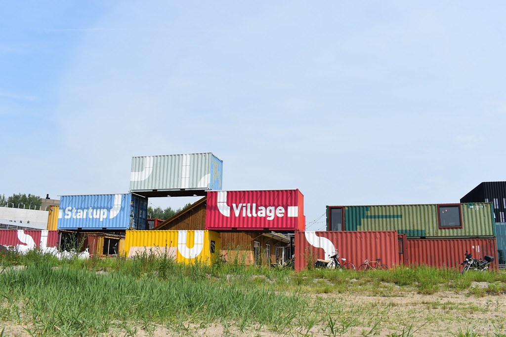 The stacked shipping containers of Startup Village at Science Park, with its sign